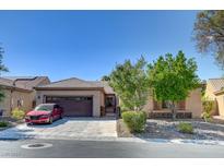 One-story house with a red car parked in the driveway at 3945 Galiceno Dr, Las Vegas, NV 89122