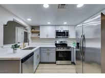 Modern kitchen featuring stainless steel appliances and quartz countertops at 5054 Spencer St # A, Las Vegas, NV 89119