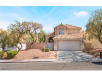 House exterior with a two-car garage and front yard at 2388 Wild Ginger Ln, Las Vegas, NV 89134