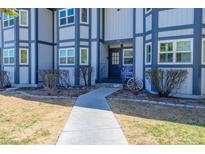 Building's entrance with walkway and landscaping at 2640 Daines Dr # 201, Las Vegas, NV 89124