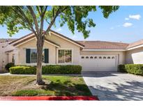 House exterior featuring landscaping and two-car garage at 1725 Pacific Breeze Dr # 0, Las Vegas, NV 89144
