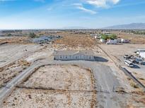 Aerial view of a single-story house on a large lot with surrounding desert landscape at 2761 Hacienda St, Pahrump, NV 89048