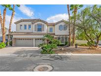 Charming two-story home with a three car garage, landscaped yard, and beautiful curb appeal at 253 White Willow Ave, Las Vegas, NV 89123