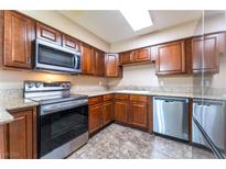 Modern kitchen with stainless steel appliances at 3151 Soaring Gulls Dr # 2084, Las Vegas, NV 89128