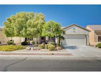 Single story home with landscaped yard at 7457 Widewing Dr, North Las Vegas, NV 89084