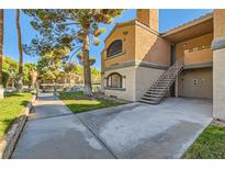 Exterior view of an apartment building with stairs and walkway at 221 Mission Catalina Ln # 105, Las Vegas, NV 89107