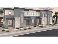 Modern three-story townhome with attractive stone and gray siding at 986 Gearus Pl, Henderson, NV 89011