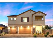 Two story house with two car garage and front patio at 5990 Viscaya Grove St, Las Vegas, NV 89118