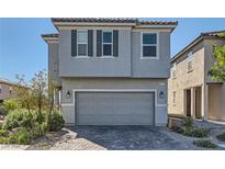Two-story home with gray exterior and two-car garage at 6971 Sylmar Ave, Las Vegas, NV 89113