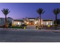 Modern luxury home with palm trees and a beautifully landscaped front yard at 40 Reflection Shores Ln, Henderson, NV 89011