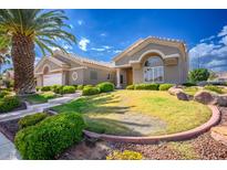 Two-story house with a landscaped yard and palm trees at 3013 High Range Dr, Las Vegas, NV 89134