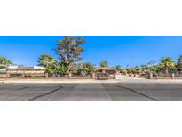 House exterior featuring a large driveway and landscaped yard at 2880 Red Rock St, Las Vegas, NV 89146