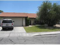 Single story home with attached garage and landscaping at 322 Oliveiro Ct, Henderson, NV 89014