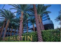 The Martin highrise building, with palm trees and landscaping at 4471 Dean Martin Dr # 606, Las Vegas, NV 89103