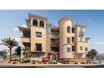 A contemporary luxury apartment building with arched entryways and a central tower at 9132 Las Manaitas Ave # 202, Las Vegas, NV 89144