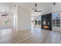 Bright living room with fireplace and hardwood floors at 5202 Misty Morning Dr, Las Vegas, NV 89118