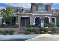 Two story home with landscaping and a front porch at 2818 Turnstone Ridge St, Henderson, NV 89044