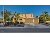 Beautiful two-story house with a three-car garage and landscaped yard at 6012 Valley Flower St, North Las Vegas, NV 89081