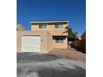 Two-story house with attached garage and neutral color scheme at 5116 Gray Ln # G, Las Vegas, NV 89119