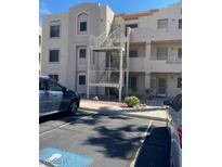 Exterior view of a residential building with stairs and parking at 2004 Mesquite Ln # 201, Laughlin, NV 89029