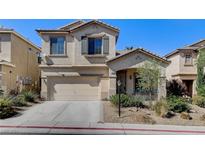 Two story house with attached garage and landscaping at 9104 Little Horse Ave, Las Vegas, NV 89143