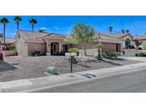 Single story home with desert landscaping and a two-car garage at 10309 Marymont Pl, Las Vegas, NV 89134