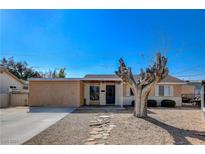 Single story home with a large tree in front yard at 2349 N Mallard St, Las Vegas, NV 89108