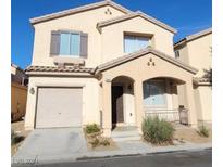 Two-story home with attached garage and desert landscaping at 6848 Mesita Ave, Las Vegas, NV 89122