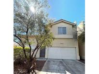 Two-story house with a large garage and mature tree at 7573 Costanoa St, Las Vegas, NV 89123