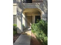 Condo building entrance with walkway and landscaping at 4712 Nara Vista Way # 103, Las Vegas, NV 89103