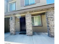 Inviting exterior featuring stone accents and a covered entryway at 5730 Sky Pointe Dr # 190, Las Vegas, NV 89130
