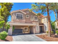 Two-story house with a large covered porch and attached garage at 1337 Via Savona Dr, Henderson, NV 89052