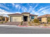 One-story home with a brick driveway and landscaping at 10996 Gardenova Ave, Las Vegas, NV 89166
