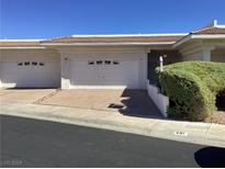 Two-car garage and landscaped front yard at 491 Marina Cv, Boulder City, NV 89005