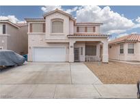 Two-story house with a covered porch and attached garage at 10029 Floragold Ct, Las Vegas, NV 89147