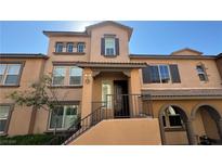 Two-story townhome with attractive stucco facade at 11404 Belmont Lake Dr # 103, Las Vegas, NV 89135