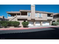 Two-story condo with attached two-car garage and landscaping at 5125 W Reno Ave # 2071, Las Vegas, NV 89118