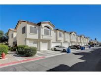 Townhouses with attached garages and landscaping at 4810 Black Bear Rd # 202, Las Vegas, NV 89149