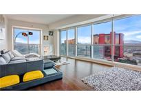 Luxury living room boasts stunning city views and hardwood floors at 2700 Las Vegas Blvd # 3708, Las Vegas, NV 89109