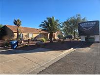 Single-story house with desert landscaping and RV parking at 340 E Longacres Dr, Henderson, NV 89015