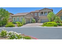 Beautiful two-story home with a three-car garage and landscaped front yard at 4093 San Franchesca Ct, Las Vegas, NV 89141