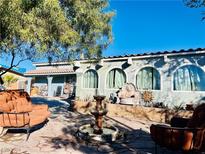 Spanish-style home with a fountain and seating area in the front yard at 3152 Sundown Dr, Las Vegas, NV 89169