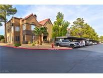 Exterior view of a two-story condo building with covered parking at 2200 S Fort Apache Rd # 1227, Las Vegas, NV 89117