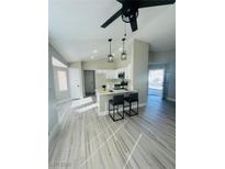 Modern kitchen with island and breakfast bar at 2736 Cathedral Ln, Las Vegas, NV 89108