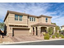 Two-story house with a three-car garage and landscaping at 6370 Ava Ridge Ave, Las Vegas, NV 89141