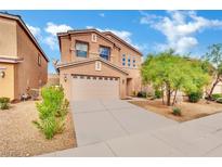 Two-story house with attached garage and landscaping at 8212 Minots Ledge Ave, Las Vegas, NV 89147