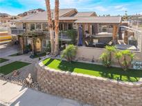 Luxury home with spacious backyard, pool, and multiple balconies at 868 Marina Dr, Boulder City, NV 89005