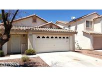 House exterior showing front yard and garage at 1013 Adobe Flat Dr, Henderson, NV 89011