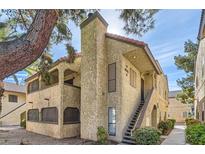 Two-story building with stairs and balconies at 4742 Obannon Dr # B, Las Vegas, NV 89102