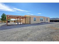 Single-story home with carport and gravel driveway at 1921 Jeane Ave, Pahrump, NV 89048